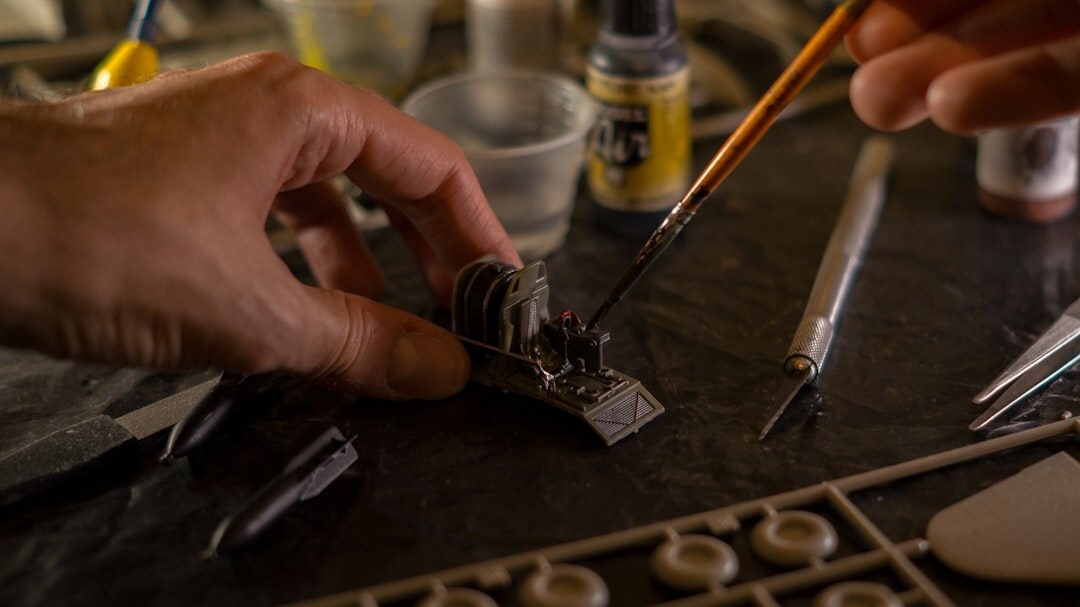 Watchmaker hands assembling a fine timepiece with tools