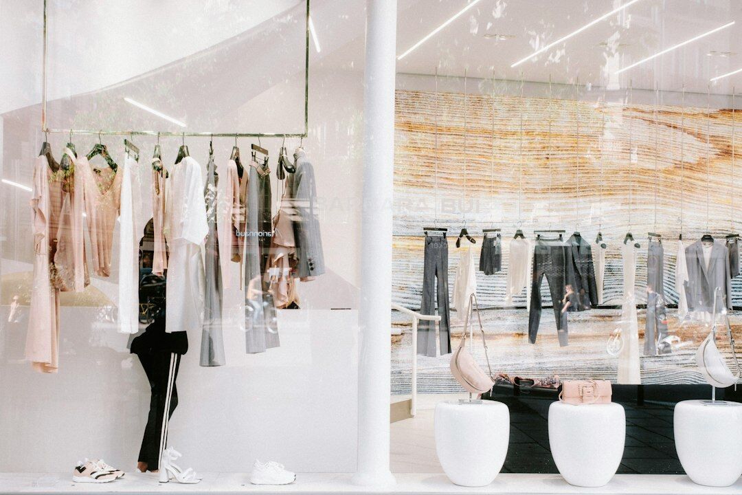 Bright modern boutique interior with large windows and neutral tones