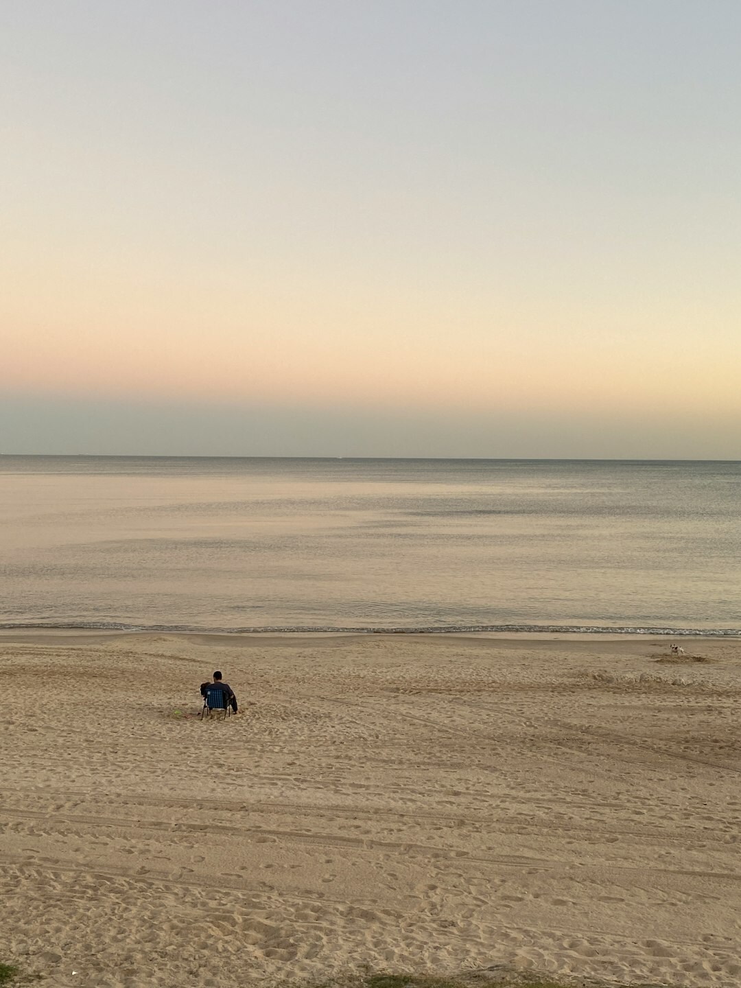 Golden hour sunset over the coast of Punta del Este with calm ocean water