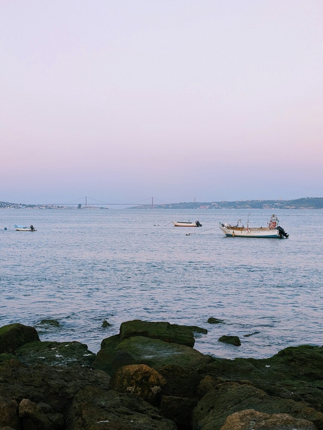 Sunset view of the Atlantic coast with boats near shore