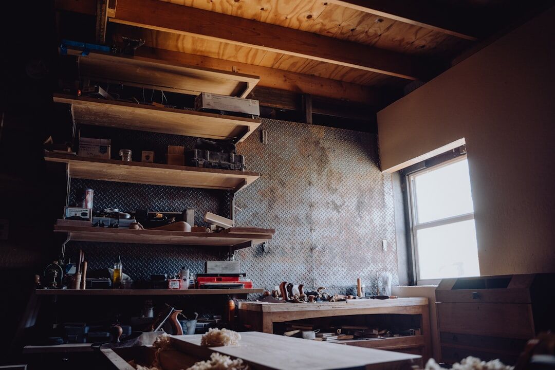 Hand-crafted acetate eyeglasses frame on wooden workbench