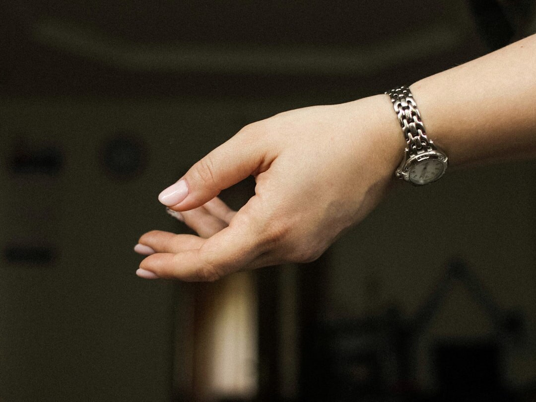 Elegant woman's hand wearing a jewelry watch with bracelet