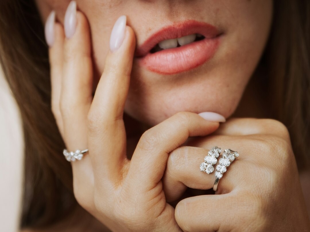 woman wearing diamond earrings